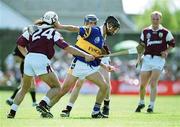 14 May 2000; Thomas Dunne of Tipperary in action against David Tierney, left, and Mark Kerins of Galway during the Church & General National Hurling League Final match between Tipperary and Galway at the Gaelic Grounds in Limerick. Photo by Brendan Moran/Sportsfile