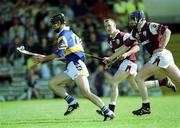 14 May 2000; Thomas Dunne of Tipperary races clear of Cathal Moore of Galway during the Church & General National Hurling League Final match between Tipperary and Galway at the Gaelic Grounds in Limerick. Photo by Brendan Moran/Sportsfile