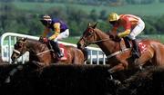 4 May 2000; Tiutchev, right, with Mick Fitzgerald up, clears the last ahead of eventual second place Frozen Groom, with Paul Carberry up, on their way to winning the Swordlestown Cup Novice Chase at Punchestown Racecourse in Kildare. Photo by Matt Browne/Sportsfile