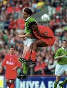 21 May 2000; Tony Cascarino of Republic of Ireland XI in action against Rigobert Song of Liverpool during the Steve Staunton and Tony Cascarino Testimonial match between Republic of Ireland XI and Liverpool at Lansdowne Road in Dublin. Photo by Damien Eagers/Sportsfile