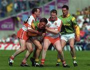 7 May 2000; Trevor Giles of Meath is tackled by Henry Downey, left, and Dermot Heaney of Derry during the Church & General National Football League Final between Derry and Meath at Croke Park in Dublin. Photo by Ray Lohan/Sportsfile
