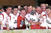 13 May 2000; Tyrone players celebrate with the Tadhg O'Cleirigh Cup following their side's victory during the All-Ireland U21 Football Championship Final match between Tyrone and Limerick at Cusack Park in Mullingar, Westmeath. Photo by Ray McManus/Sportsfile