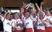 13 May 2000; Owen Mulligan of Tyrone lifts the Tadhg O'Cleirigh Cup alongside team-mates following their side's victory during the All-Ireland U21 Football Championship Final match between Tyrone and Limerick at Cusack Park in Mullingar, Westmeath. Photo by Damien Eagers/Sportsfile