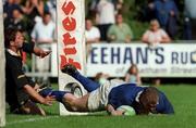 13 May 2000; Victor Costello of St Mary's dives over to score a try, despite the tackle of Simon Mason of Ballymena during the AIB All-Ireland League Semi-Final match between St Mary’s and Ballymena at Templeville Road in Dublin. Photo by Matt Browne/Sportsfile