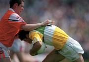 7 May 2000; Vinny Claffey of Offaly in action against Nicky Malone of Louth during the Church & General National Football League Division 2 Final match between Louth and Offaly at Croke Park in Dublin. Photo by Brendan Moran/Sportsfile