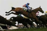12 April 2004; Granit D'Estruval, with Brian Harding up, jumps the last first during the first circuit on their way to winning the Powers Gold Label Irish Grand National Handicap Steeplechase at Fairyhouse Racecourse in Ratoath, Meath. Photo by Damien Eagers/Sportsfile