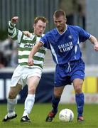 12 April 2004; Alan Reynolds of Waterford United in action against Trevor Molloy of Shamrock Rovers during the Eircom League Premier Division match between Shamrock Rovers and Waterford United at Richmond Park in Dublin. Photo by Brendan Moran/Sportsfile
