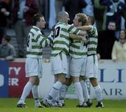 12 April 2004; Shane Robinson of Shamrock Rovers, hidden, is congratulated by team-mates, from left, Mark O'Brien, Paul Caffrey, Stephen Gough and Trevor Croly after scoring his side's second goa during the Eircom League Premier Division match between Shamrock Rovers and Waterford United at Richmond Park in Dublin. Photo by Brendan Moran/Sportsfile