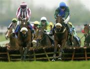 13 April 2004; Macs Joy, right, with Barry Geraghty up, jumps the last alongside eventual second place Tiger Cry, with David Casey up, on their way to winning the Menolly Homes Handicap Hurdle at Fairyhouse Racecourse in Ratoath, Meath. Photo by Damien Eagers/Sportsfile