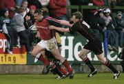 16 April 2004; Christian Cullen of Munster in action against Alistair Warnock of Edinburgh during the Celtic League match between Munster and Edinburgh at Musgrave Park in Cork. Photo by Brendan Moran/Sportsfile
