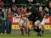 16 April 2004; Stephen Keogh of Munster is tackled by Guy Perrett of Edinburgh during the Celtic League match between Munster and Edinburgh at Musgrave Park in Cork. Photo by Brendan Moran/Sportsfile