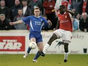 16 April 2004; Joseph Ndo of St Patrick's Athletic in action against Kevin O'Brien of Waterford United during the Eircom League Premier Division match between St Patrick's Athletic and Waterford United at Richmond Park in Dublin. Photo by Pat Murphy/Sportsfile