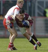 18 April 2004; Padraig Joyce of Galway is tackled by Kevin Hughes of Tyrone during the Allianz National Football League Division 1 Semi-Final match between Tyrone and Galway at Healy Park in Omagh, Tyrone. Photo by Damien Eagers/Sportsfile