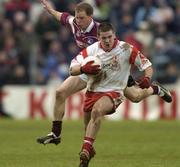 18 April 2004; Philip Jordan of Tyrone in action against Michael Donnellan of Galway during the Allianz National Football League Division 1 Semi-Final match between Tyrone and Galway at Healy Park in Omagh, Tyrone. Photo by Damien Eagers/Sportsfile