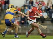 24 April 2004; Diarmuid O'Sullivan of Cork in action against Tony Griffin of Clare during the Allianz National Hurling League Group 1 Round 3 match between Cork and Clare at Páirc U’ Rinn in Cork. Photo by Matt Browne/Sportsfile