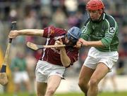 25 April 2004; Damien Hayes of Galway is tackled by Brian Carroll of Limerick during the Allianz National Hurling League Group 1 Round 3 match between Galway and Limerick at Pearse Stadium in Galway. Photo by Ray McManus/Sportsfile