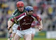 25 April 2004; Damien Hayes of Galway is tackled by Brian Carroll of Limerick during the Allianz National Hurling League Group 1 Round 3 match between Galway and Limerick at Pearse Stadium in Galway. Photo by Ray McManus/Sportsfile