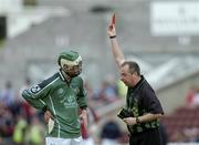 25 April 2004; Referee Aodan Mac Suibhne shows a red card to James O'Brien of Limerick during the Allianz National Hurling League Group 1 Round 3 match between Galway and Limerick at Pearse Stadium in Galway. Photo by Ray McManus/Sportsfile