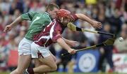 25 April 2004; Alan Kerins of Galway is tackled by Mark Foley of Limerick during the Allianz National Hurling League Group 1 Round 3 match between Galway and Limerick at Pearse Stadium in Galway. Photo by Ray McManus/Sportsfile