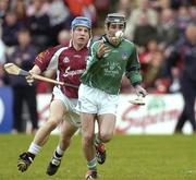 25 April 2004; Michael Cahill of Limerick in action against Kevin Broderick of Galway during the Allianz National Hurling League Group 1 Round 3 match between Galway and Limerick at Pearse Stadium in Galway. Photo by Ray McManus/Sportsfile