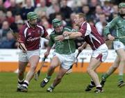 25 April 2004; Donnacha Sheehan of Limerick is tackled by Fergal Healy, left, and Damien Joyce of Galway during the Allianz National Hurling League Group 1 Round 3 match between Galway and Limerick at Pearse Stadium in Galway. Photo by Ray McManus/Sportsfile