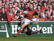 25 April 2004; Christian Cullen of Munster in action against Ayoola Erinle of London Wasps during the Heineken Cup Semi-Final match between Munster and London Wasps at Lansdowne Road in Dublin. Photo by Brendan Moran/Sportsfile