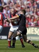 25 April 2004; Peter Stringer of Munster is tackled by Mark Van Gisbergen of London Wasps during the Heineken Cup Semi-Final match between Munster and London Wasps at Lansdowne Road in Dublin. Photo by Brendan Moran/Sportsfile
