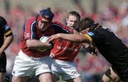 25 April 2004; Anthony Foley of Munster is tackled by Greg Dowd of London Wasps during the Heineken Cup Semi-Final match between Munster and London Wasps at Lansdowne Road in Dublin. Photo by Brendan Moran/Sportsfile