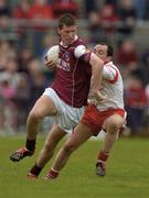 25 April 2004; John Devane of Galway in action against Brian Dooher of Tyrone during the Allianz National Football League Semi-Final Replay match between Galway and Tyrone at Pearse Stadium in Galway. Photo by Brian Lawless/Sportsfile