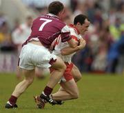 25 April 2004; Brian Dooher of Tyronein action against Seán îg De Paor of Tyrone during the Allianz National Football League Semi-Final Replay match between Galway and Tyrone at Pearse Stadium in Galway. Photo by Brian Lawless/Sportsfile