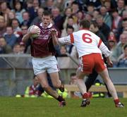 25 April 2004; Joe Devane of Galway in action against Gavin Devlin of Tyrone during the Allianz National Football League Semi-Final Replay match between Galway and Tyrone at Pearse Stadium in Galway. Photo by Ray McManus/Sportsfile