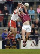 25 April 2004; John Devane of Galway in action against Brendan Donnelly of Tyrone during the Allianz National Football League Semi-Final Replay match between Galway and Tyrone at Pearse Stadium in Galway. Photo by Brian Lawless/Sportsfile
