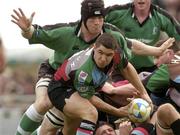25 April 2004; Simon Keogh of NEC Harlequins under pressure from John O'Sullivan of Connacht during the Parker Pen Challenge Cup Semi-Final 2nd Leg match between Connacht and NEC Harlequins at the Sportsground in Galway. Photo by Brian Lawless/Sportsfile