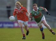 25 April 2004; Nollaig Cleary of Cork in action against Yvonne Byrne of Mayo during the Suzuki Ladies National Football League Final match between Mayo and Cork at Pearse Stadium in Galway. Photo by Brian Lawless/Sportsfile