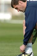 26 April 2004; Roy Keane ties his laces during a Republic of Ireland training session at Malahide Football Club in Malahide, Dublin. Photo by David Maher/Sportsfile