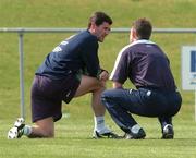 26 April 2004; Roy Keane, left, in conversation with team physio Ciaran Murray during a Republic of Ireland training session at Malahide Football Club in Malahide, Dublin. Photo by David Maher/Sportsfile