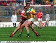 7 May 2000; James Grennan of Offaly in action against Nicky Malone of Louth during the Church & General National Football League Division 2 Final between Louth and Offaly at Croke Park in Dublin. Photo by Brendan Moran/Sportsfile
