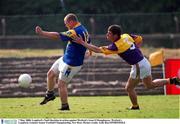 7 May 2000; Longford's Niall Sheridan in action against Wexford's Sean O'Shaughnessy. Wexford v Longford, Leinster Senior Football Championship, New Ross. Picture credit; Aoife Rice/SPORTDSILE