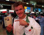 Shane Healy with his &quot;Olympics passport&quot; at Dublin Airport.   Athletics.