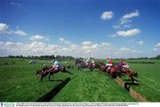 2 May 2000; Tearaway King with Mr John Thomas McNamara up leads the eventual winner, Digacre, 2, Mr Aonghus McNamara and third placed Buaites And Fadas, 19,  Mr Philip Fenton over the double bank in the Ernest & Young Steplechase for the Ladiesa Cup at Punchestown. Horse Racing. Picture credit; Matt Browne/SPORTSFILE