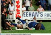 13 May 2000. Victor Costello, St Mary's scores his try despite the tackle of Simon Mason, Ballymena. All-Ireland League Rugby semi-final, St Mary's v Ballymena, Templeville Road, Dublin. Picture credit; Matt Browne/SPORTSFILE