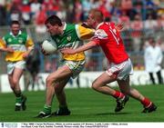 7 May 2000; Ciaran McManus of Offaly in action against J.P. Rooney of Louth during the Church & General National Football League Division 2 Final between Louth and Offaly at Croke Park in Dublin. Photo by Ray Lohan/Sportsfile