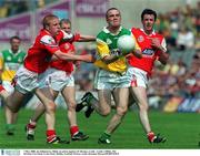 7 May 2000; Joe Kilmurray of Offaly in action against J.P. Rooney of Louth during the Church & General National Football League Division 2 Final between Louth and Offaly at Croke Park in Dublin. Photo by Brendan Moran/Sportsfile