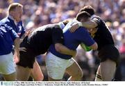 13 May 2000. David Clare, St Mary's is tackled by Simon Mason, right, Ballymena. All-Ireland League Rugby semi-final, St Mary's v Ballymens, Templeville Road, Dublin. Picture credit; Brendan Moran...*(EDI)*
