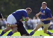 13 May 2000. David Clare, St Mary's is tackled by Simon Mason, Ballymena. All-Ireland League Rugby semi-final, St Mary's v Ballymens, Templeville Road, Dublin. Picture credit; Brendan Moran...*(EDI)*