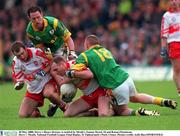 20 May 2000; Derry's Henry Downey is tackled by Meath's Tommy Dowd, 18 and Ronan Fitzsimons. Derry v Meath, National Football League Final Replay, St Tighearnach's Park, Clones. Picture credit; Aoife Rice/SPORTSFILE