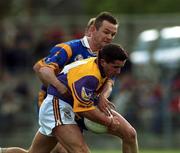 20 May 2000; John Hegarty, Wexford, is tackled by Mark Coffey, Wicklow. during the Bank of Ireland Football Championship, Wicklow v Wexford, Aughrim, Co. Wicklow Picture credit; Matt Browne/SPORTSFILE