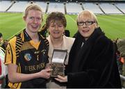 1 March 2015; Kellyann Doyle, of Piltown, Co. Kilkenny, receives the Player of the Match award from Maol Muire Tynan, right, AIB, alongside Aileen Lawlor, centre, Camogie Association President, after the AIB All Ireland Intermediate Club Camogie Final, Piltown v Lismore. Croke Park, Dublin. For exclusive content and to see why the AIB Club Championships are #TheToughest follow us @AIB_GAA and on Facebook at facebook.com/AIBGAA. Croke Park, Dublin. Picture credit: Ray McManus / SPORTSFILE