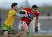 1 March 2015; Tomas Clancy, Cork, in action against Odhran MacNiallais, Donegal. Allianz Football League, Division 1, Round 3, Donegal v Cork. Fr Tierney Park, Ballyshannon, Co. Donegal. Picture credit: Oliver McVeigh / SPORTSFILE