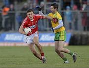 1 March 2015; Mark Collins, Cork, in action against Odhran MacNiallais, Donegal. Allianz Football League, Division 1, Round 3, Donegal v Cork. Fr Tierney Park, Ballyshannon, Co. Donegal. Picture credit: Oliver McVeigh / SPORTSFILE